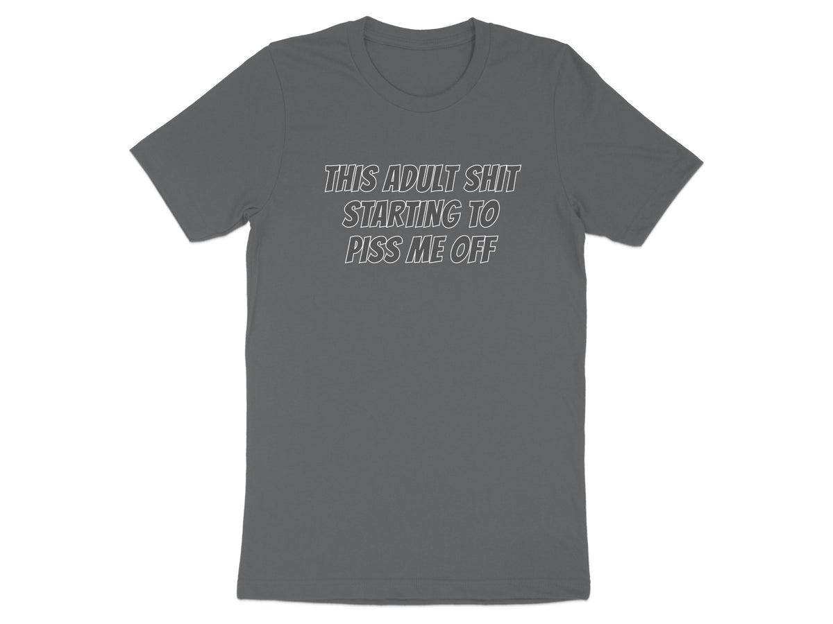Gray t-shirt with white text reading "THIS ADULT SHIT STARTING TO PISS ME OFF".