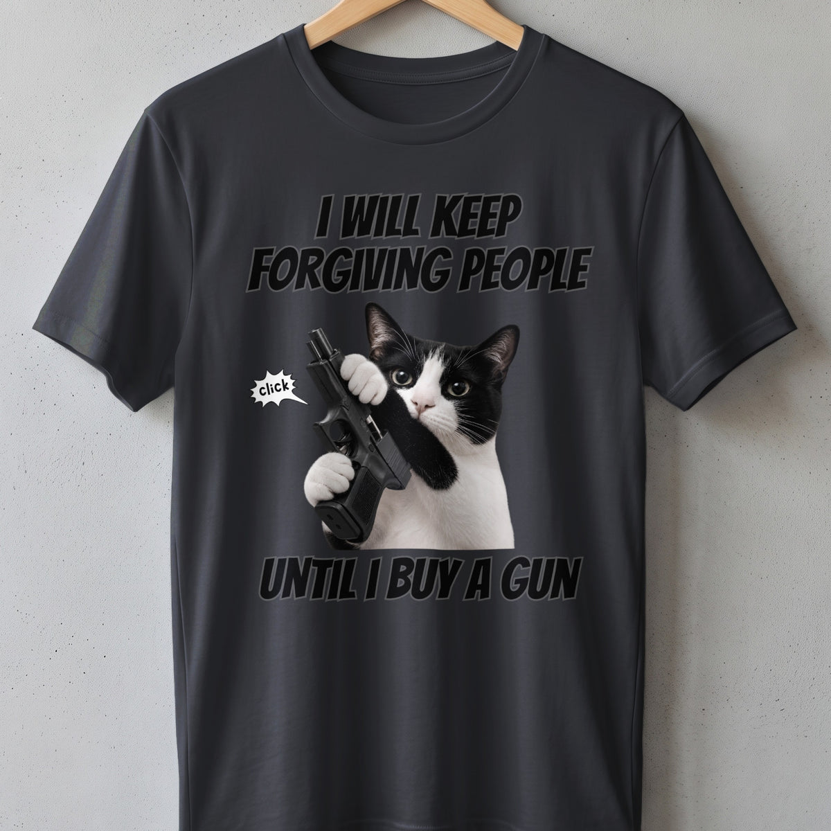 Black and white cat holding a gun on a dark grey t-shirt with text.