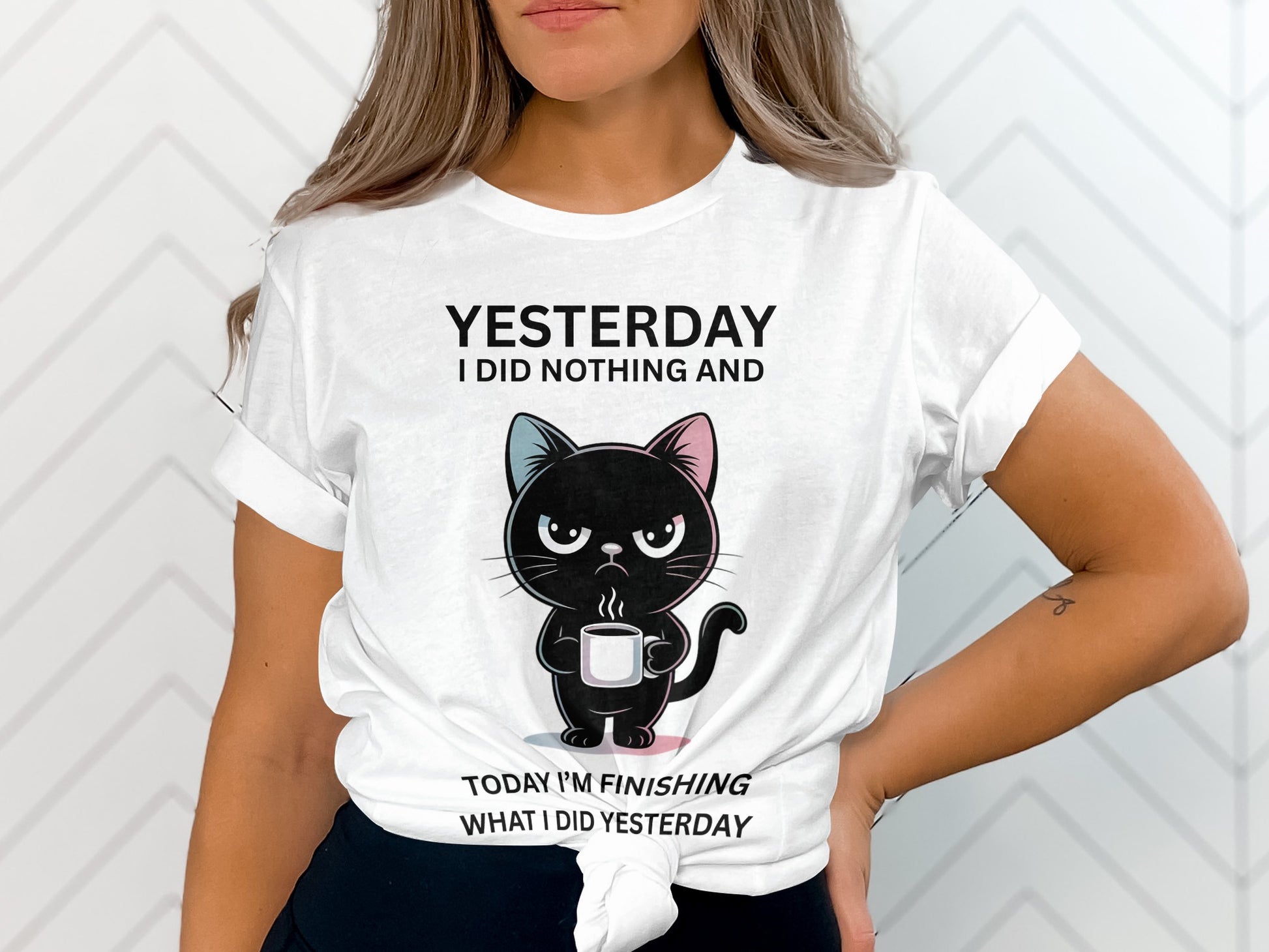 White t-shirt with distressed black lettering and an angry cartoon cat holding coffee.