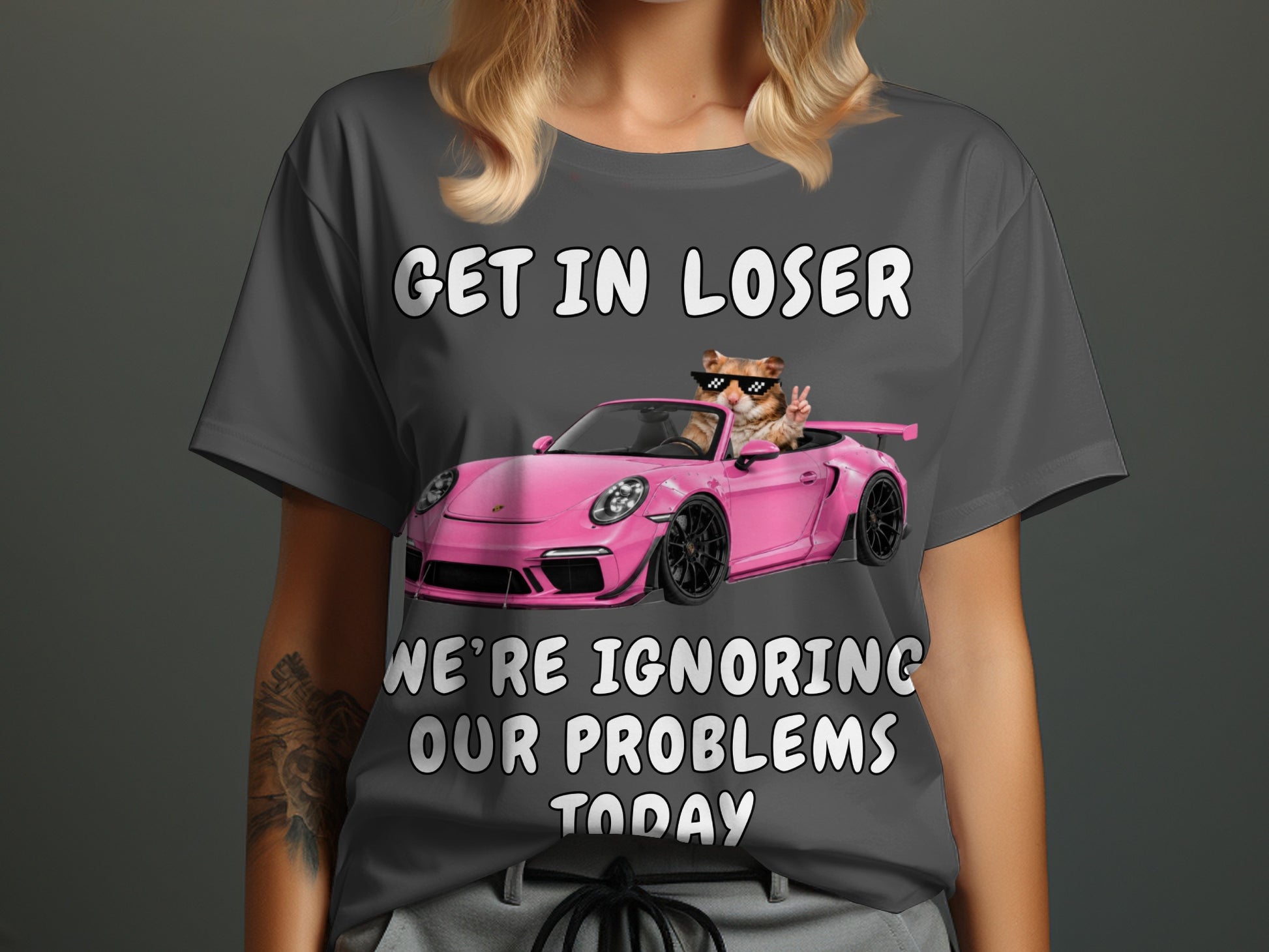 Cat in sunglasses drives pink car with text "Get in loser, we're ignoring our problems today".