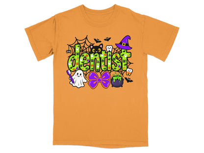 An orange short-sleeve t-shirt features a green patterned text graphic reading dentist surrounded by Halloween icons.