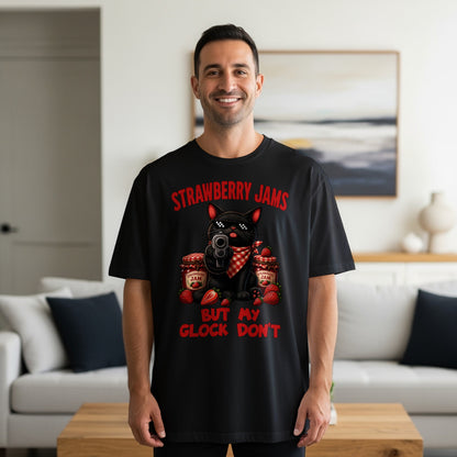 Black t-shirt with a cartoon cat holding a gun and strawberry jam jars.