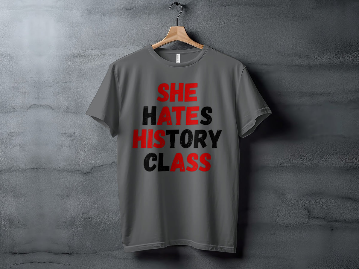 Gray t-shirt with red and black text that reads "SHE HATES HISTORY CLASS".