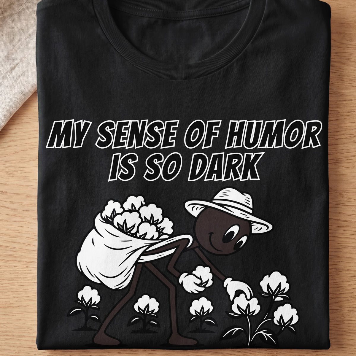 Black t-shirt with cartoon character picking cotton and text "My Sense of Humor is So Dark".