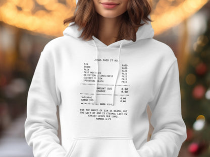 White hoodie with "Jesus Paid It All" text, listing sins and the Bible verse Romans 6:23.