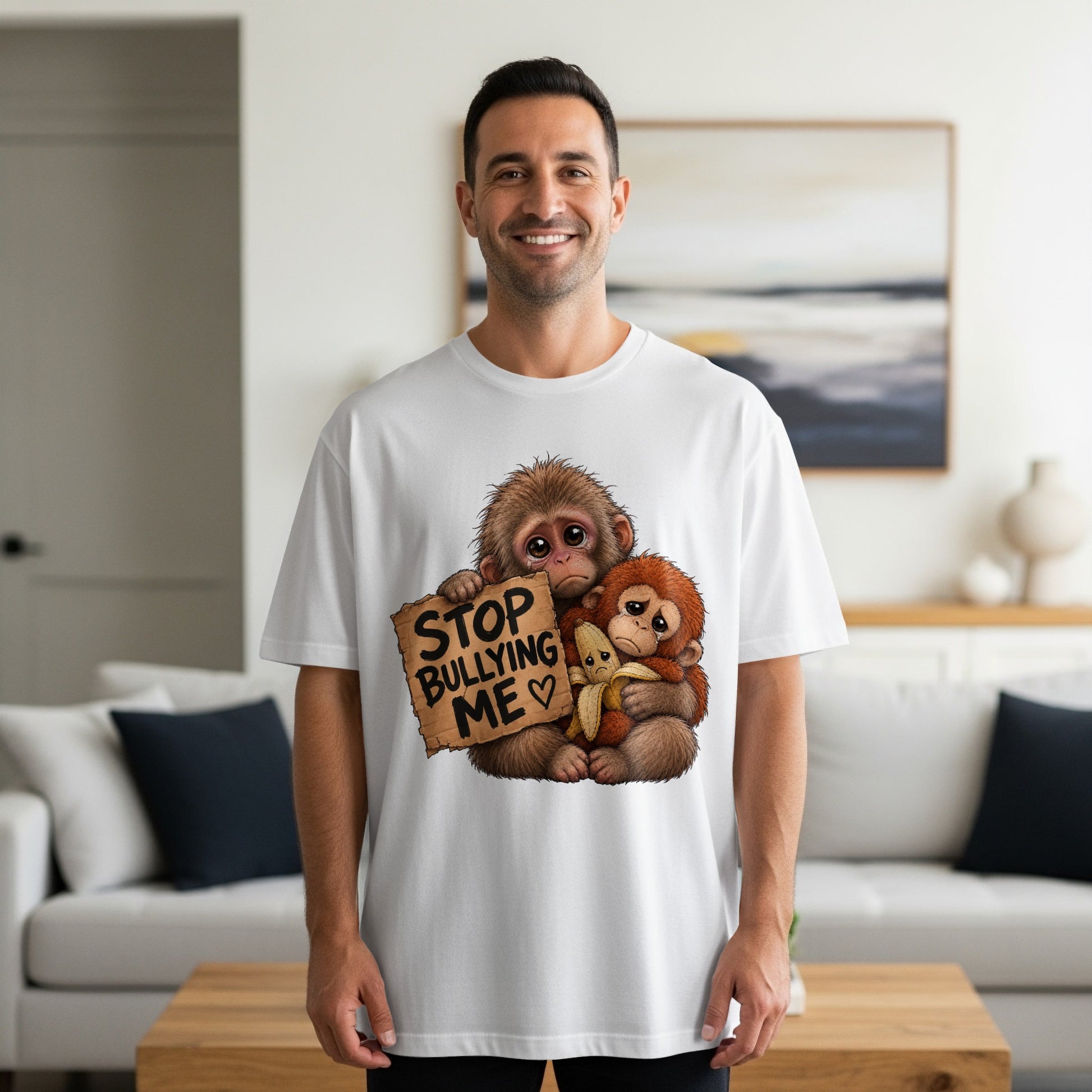 Two sad monkeys holding a sign that says "STOP BULLYING ME".