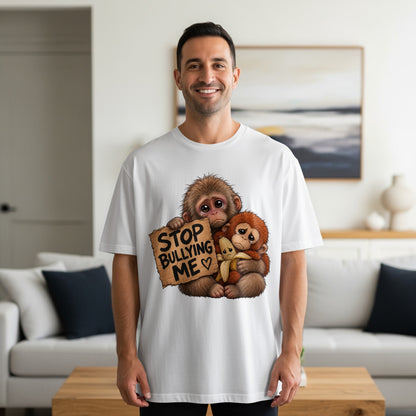 Two sad monkeys holding a sign that says "STOP BULLYING ME".