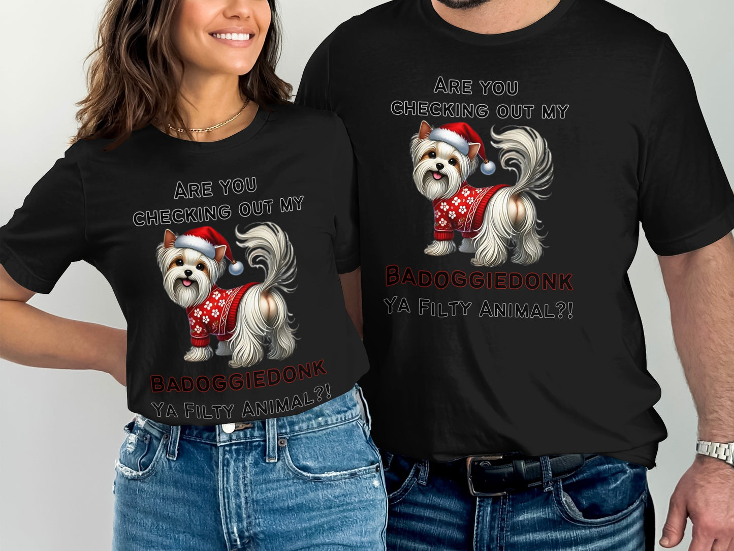 Two people wear black t-shirts with a Yorkshire terrier graphic and text.