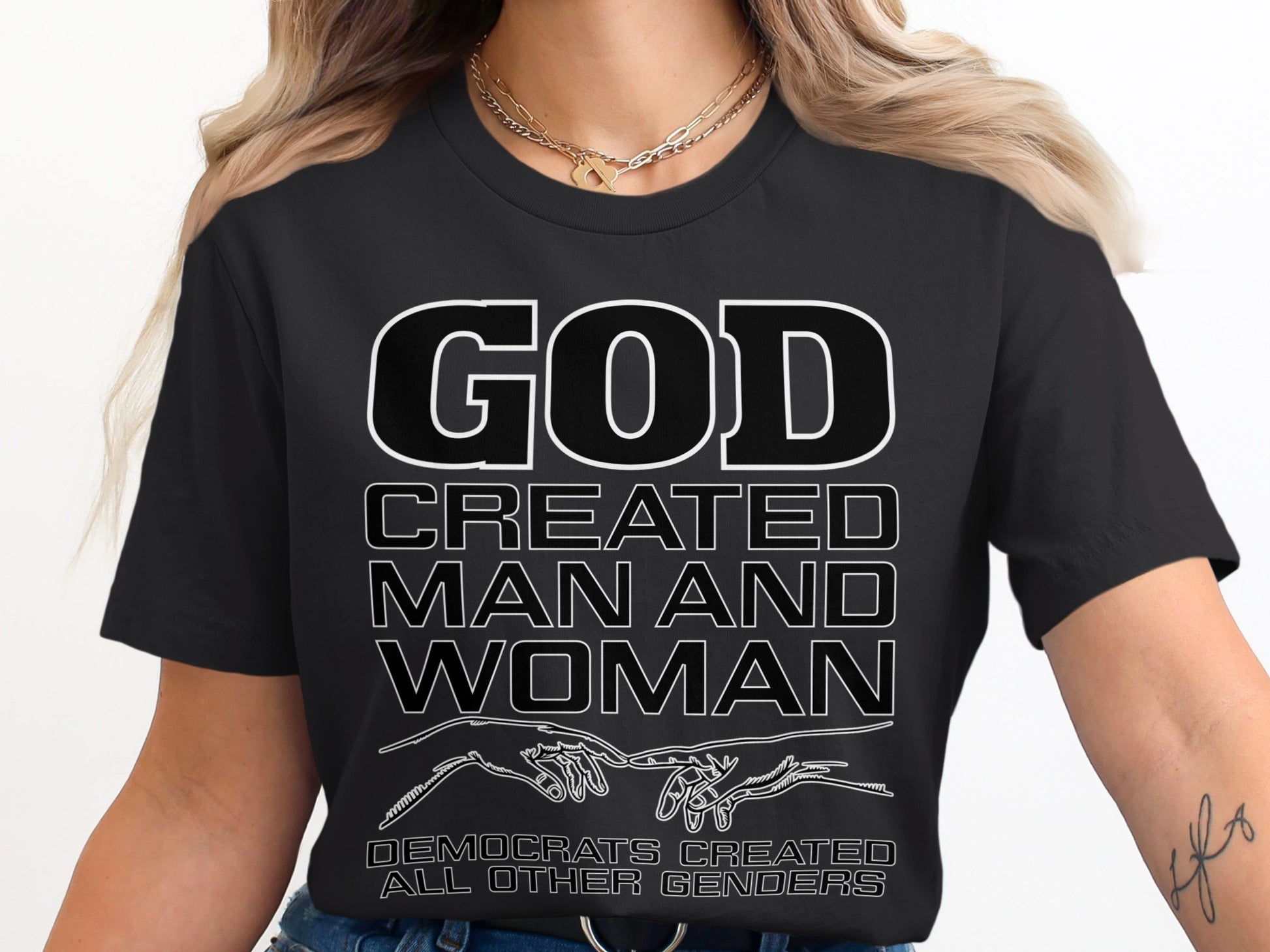 Black t-shirt with text: GOD CREATED MAN AND WOMAN. DEMOCRATS CREATED ALL OTHER GENDERS.
