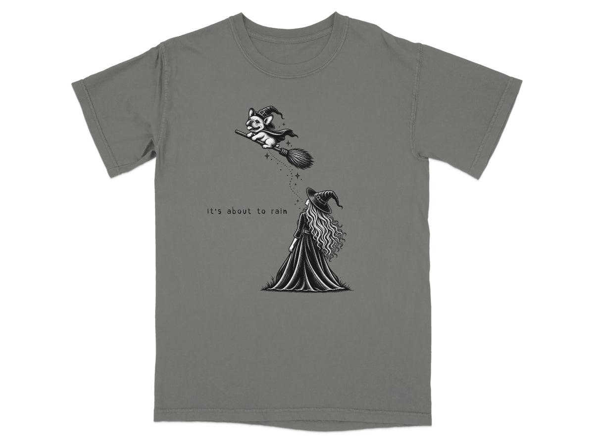 French bulldog in witch hat flies on broom, witch below reads "It's about to rain".