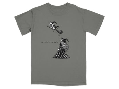 French bulldog in witch hat flies on broom, witch below reads "It's about to rain".