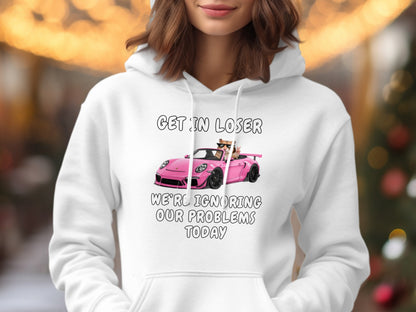 White hoodie with "GET IN LOSER" and a pink car with cats ignoring problems.
