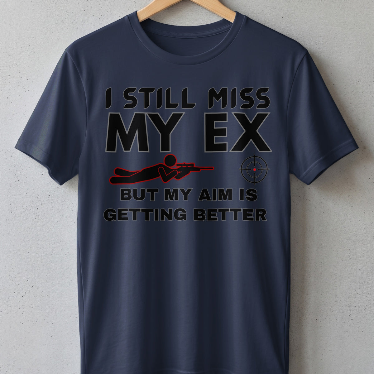 Dark blue t-shirt with "I STILL MISS MY EX BUT MY AIM IS GETTING BETTER" text.