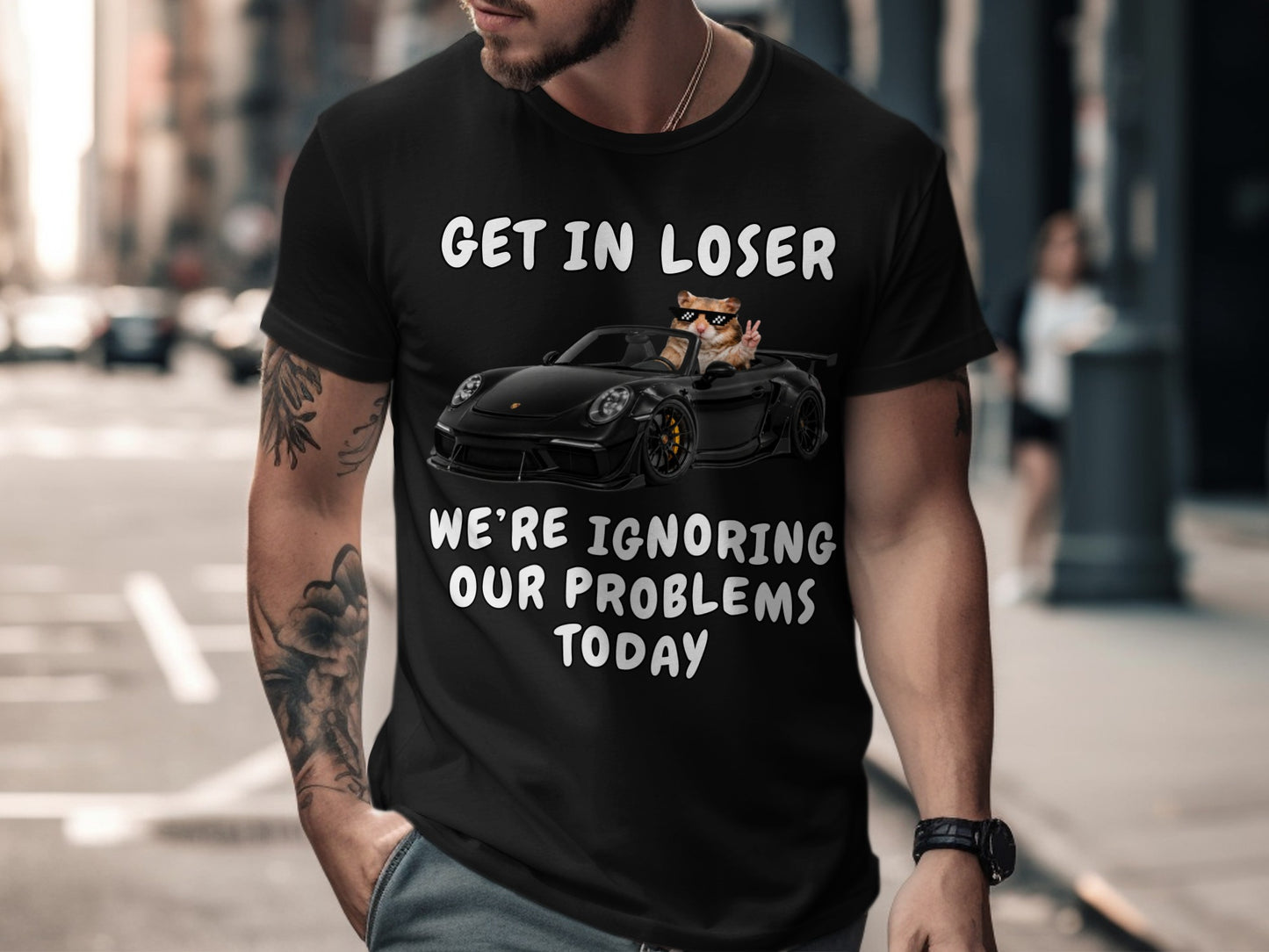 Black t-shirt with text and a hamster in a convertible.