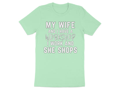 Light mint t-shirt with text: "My wife and I have a workshop I work and she shops."