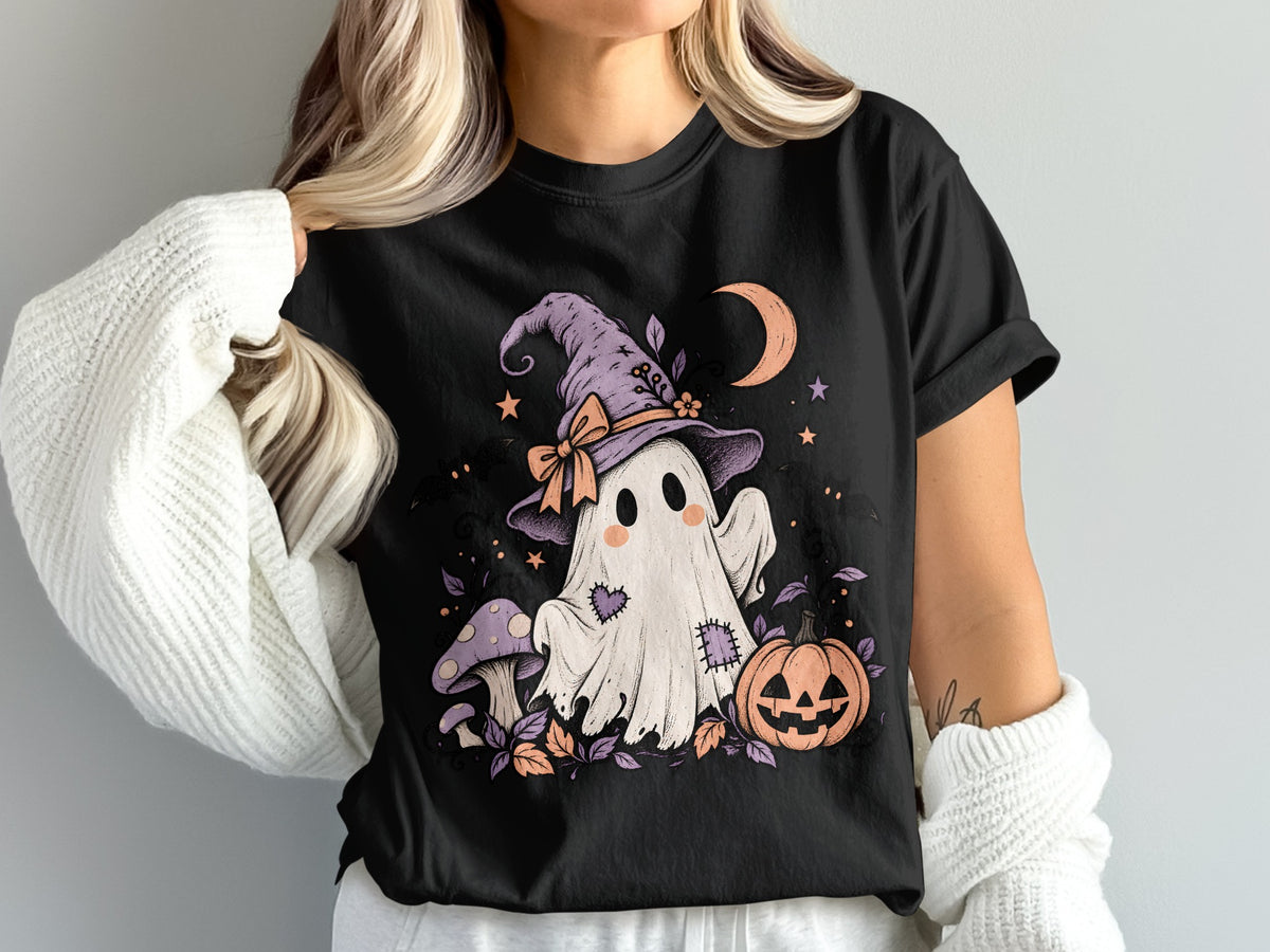Black t-shirt with ghost, pumpkin, mushroom, moon, and stars Halloween graphic.