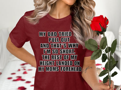 Maroon t-shirt with text: My dad tried to pull out, and that's why I'm so short.
