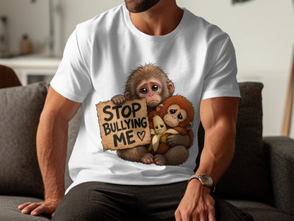 Two sad monkeys hug a banana, one holding a sign saying "STOP BULLYING ME".