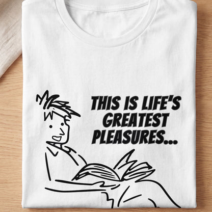 White t-shirt with a black line drawing of a person reading, text reads "THIS IS LIFE'S GREATEST PLEASURES..."