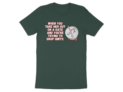 Green t-shirt with text "When you take her out on a date and you're trying to drop hints:" and a drawing.