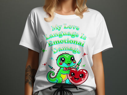 White t-shirt with cartoon dinosaur, heart, and knives, text says "My Love Language Is Emotional Damage".