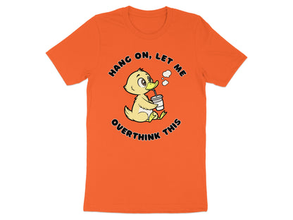 Orange t-shirt with a cartoon duck drinking from a cup that says "Hang on, let me overthink this."