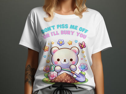White t-shirt with cartoon bear digging with a shovel and flowers, text reads "Don't piss me off or I'll bury you".