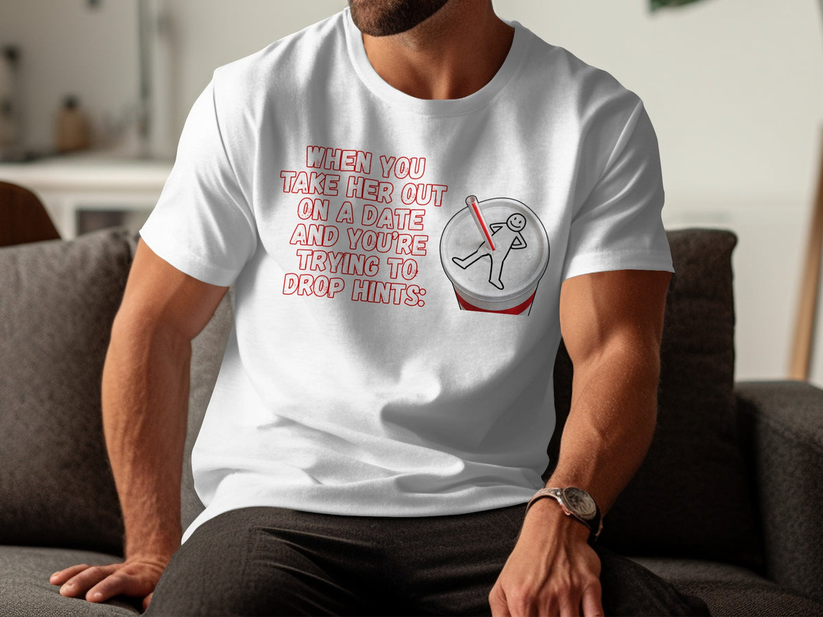 White t-shirt with red text and graphic of a stick figure on a soda can.