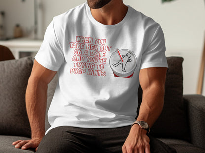 White t-shirt with red text and graphic of a stick figure on a soda can.