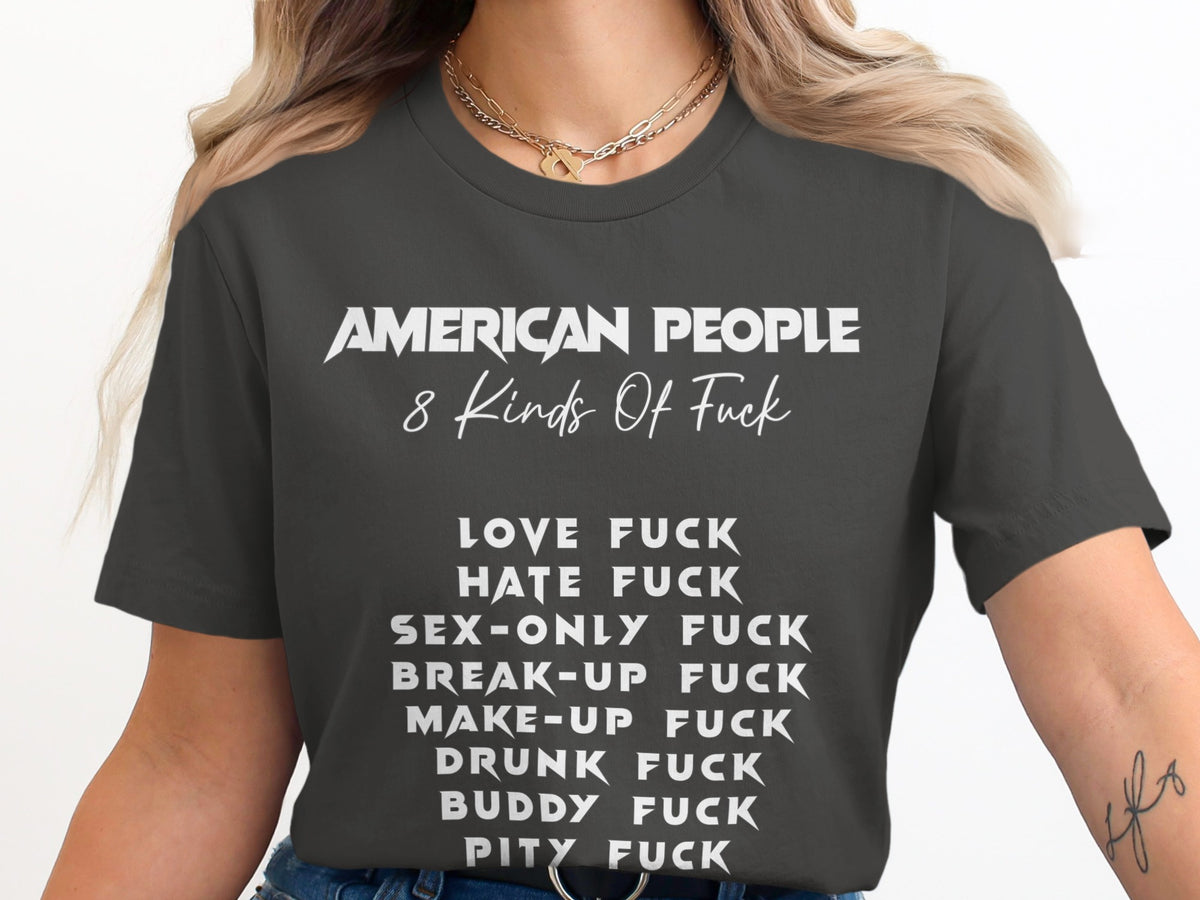 Dark gray t-shirt with white text: "AMERICAN PEOPLE 8 Kinds Of Fuck" followed by a list.