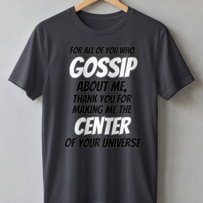 Dark grey t-shirt with white text "GOSSIP ABOUT ME, THANK YOU FOR MAKING ME THE CENTER OF YOUR UNIVERSE".