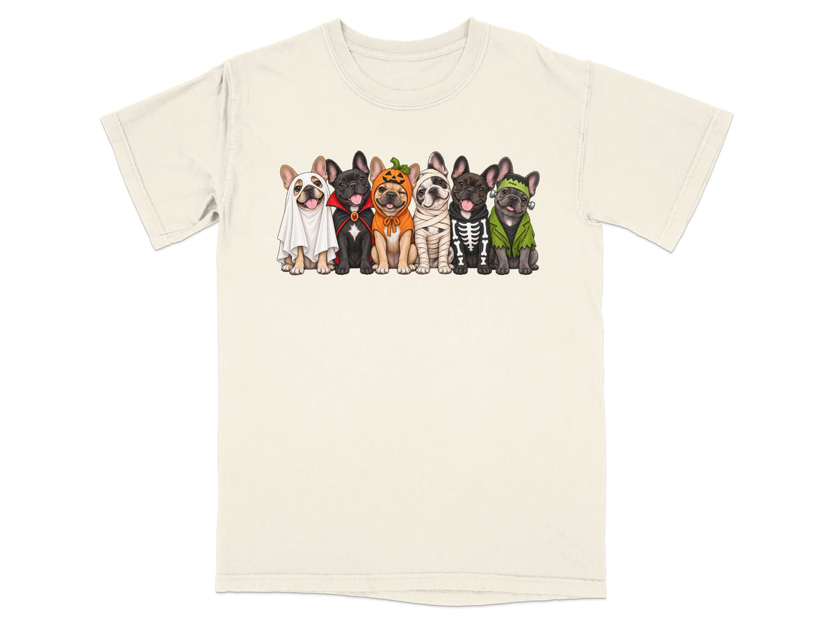 Six French Bulldogs dressed in Halloween costumes on a cream t-shirt.