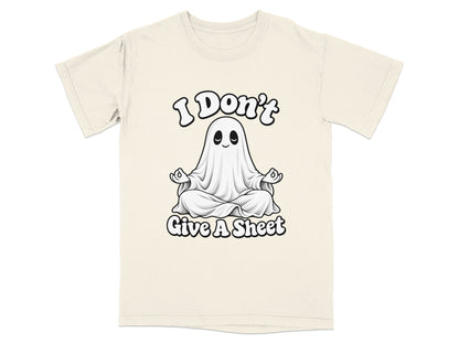 Cream t-shirt with graphic of a ghost meditating and text "I Don't Give A Sheet".