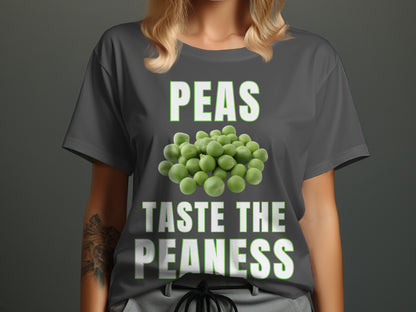 Dark grey t-shirt with white text "PEAS TASTE THE PEANESS" and pile of peas.