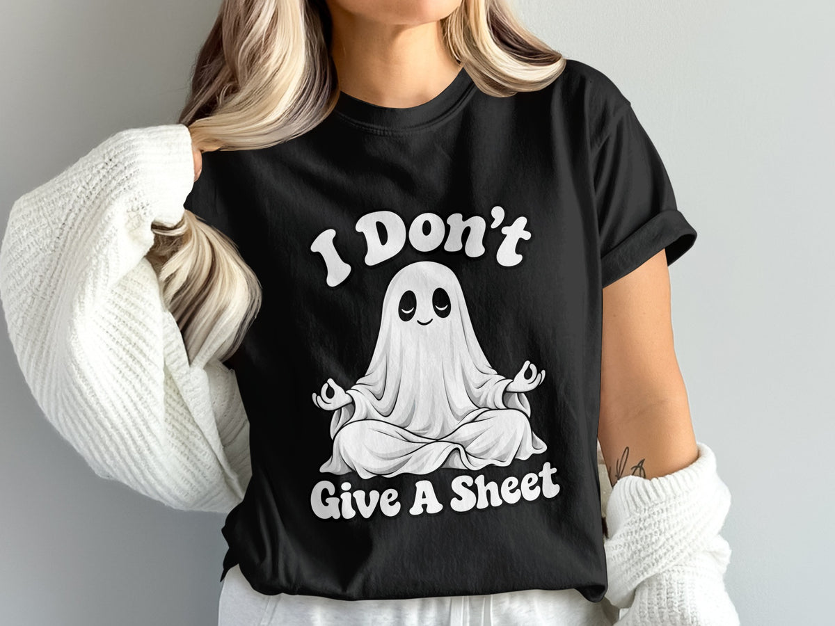 Black t-shirt with white text and a cartoon ghost meditating, saying "I Don't Give A Sheet".