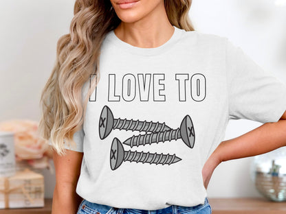 White t-shirt with "I LOVE TO" and three cartoon screws.