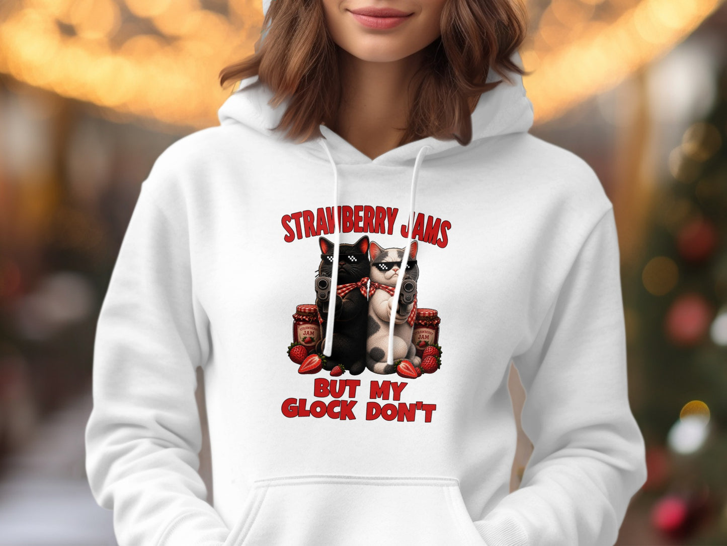 White hoodie with graphic of cats holding guns, strawberry jam jars, and text.