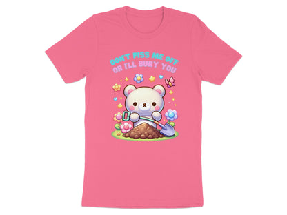 Pink t-shirt with a cartoon bear holding a shovel next to a pile of dirt.