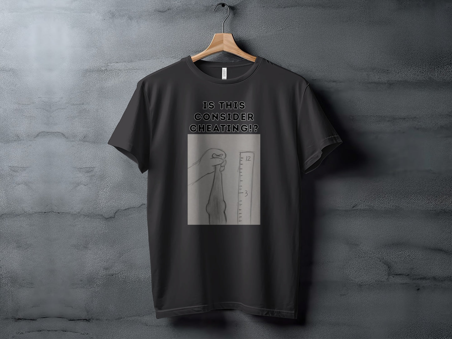 Black t-shirt with text and a drawing of a hand holding a measuring tape.
