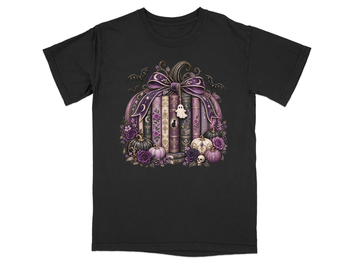 Black t-shirt with a Halloween-themed pumpkin design featuring books, pumpkins, flowers, and bats.