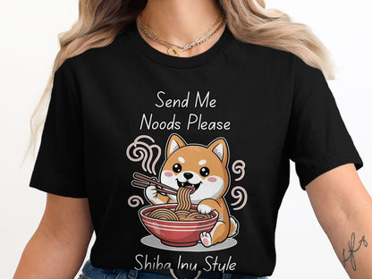 Black t-shirt with a cartoon Shiba Inu eating noodles, text "Send Me Noods Please. Shiba Inu Style."