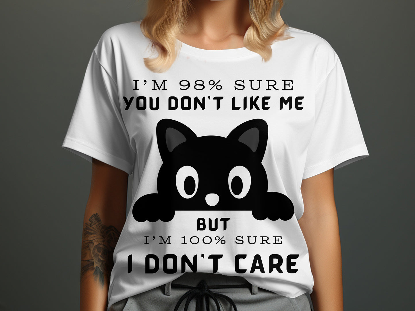 White t-shirt with black text and cat graphic: "I'm 98% sure you don't like me. But I'm 100% sure I don't care."
