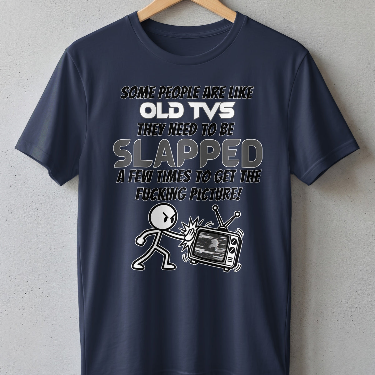 Dark blue t-shirt with text and graphic of a stick figure hitting an old television.