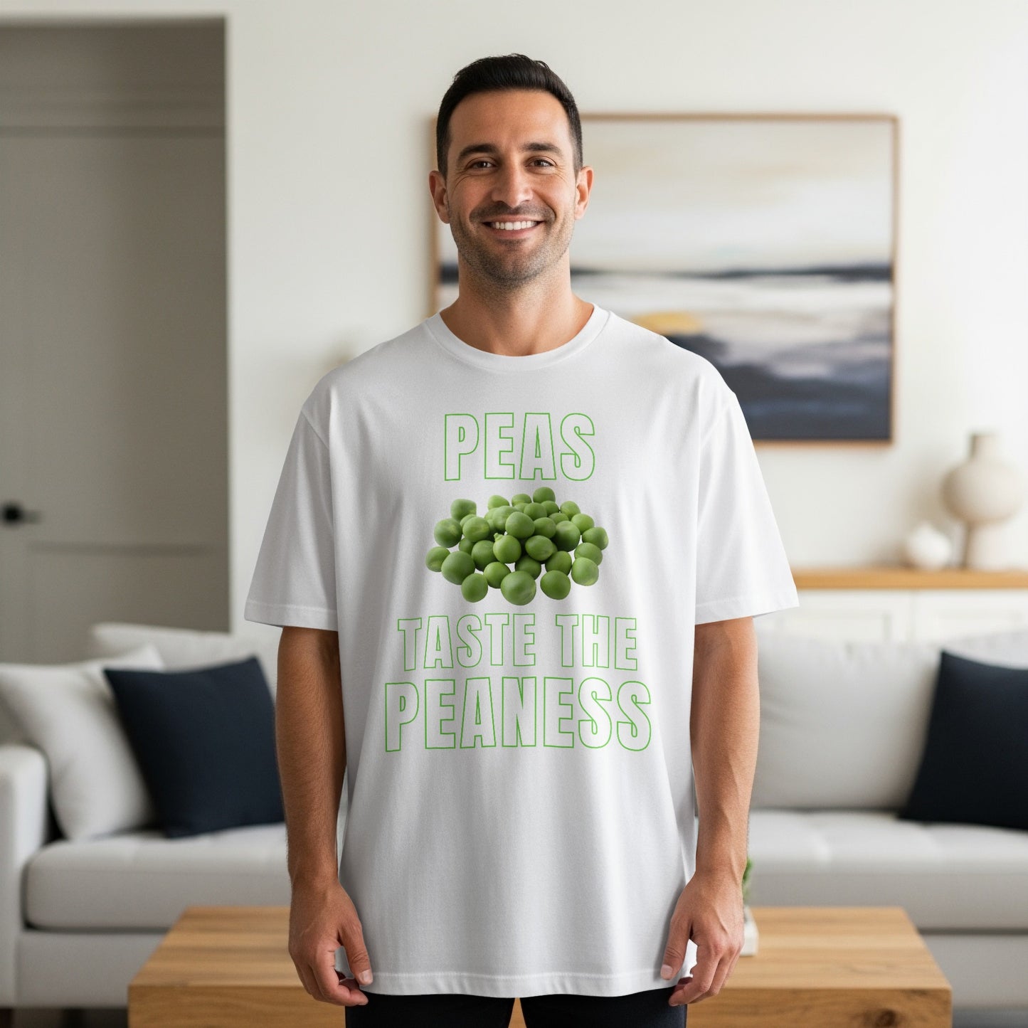 White t-shirt with green text "PEAS TASTE THE PEANESS" and a pile of peas.