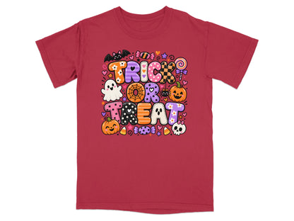 Red t-shirt with "Trick or Treat" in colorful, patterned letters and Halloween icons.