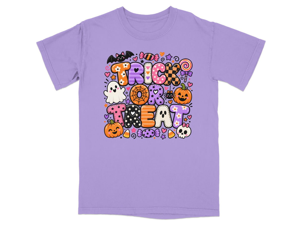 Purple t-shirt with "TRICK OR TREAT" in colorful Halloween-themed letters and icons.