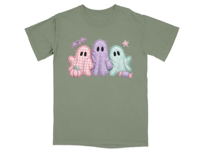 Green t-shirt with three pastel ghosts, bat, pumpkin, and candy applique design.