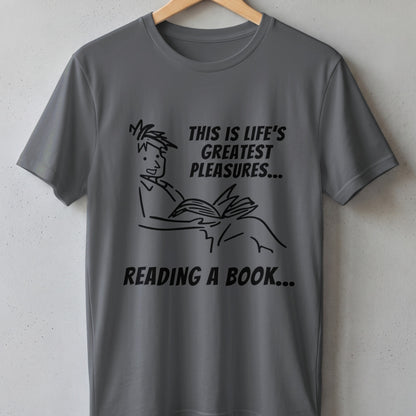 Gray t-shirt with line drawing of a person reading and text "THIS IS LIFE'S GREATEST PLEASURES... READING A BOOK...".