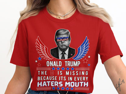 Red t-shirt with Donald Trump graphic and text "The D is missing because it's in every haters mouth".