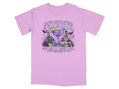 Purple t-shirt with Halloween cocktail graphic and text.
